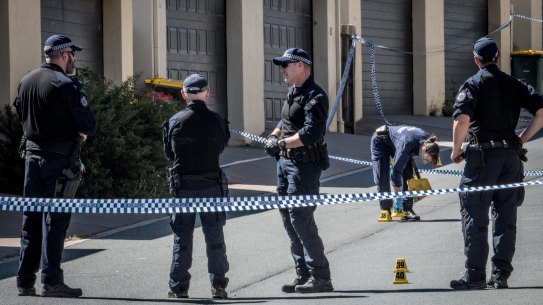 Police investigating at the scene of the alleged murder.