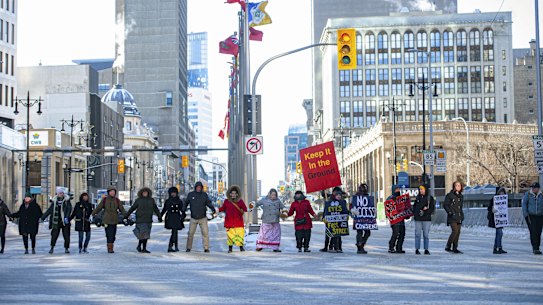 Supporters of the Wetsuweten First Nation's protest to keep pipeline workers out of the B.C. First Nation's traditional territory gather in Winnipeg, Manitoba.
