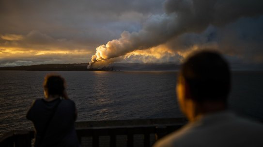A pile of woodchips burn at the local timber mill in Eden, NSW.