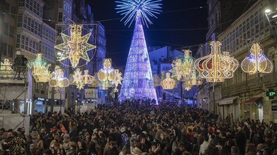 Crowds attend the lighting ceremony for Christmas decorations in Vigo, Spain.