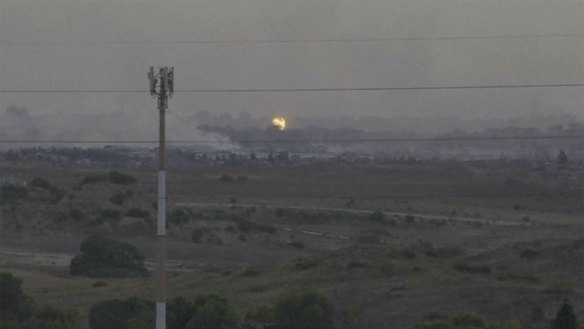 A screenshot of footage from southern Israel that shows flames and smoke rising from what Palestinian medics say is an Israeli airstrike in Gaza.
