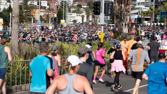Runners arrive in Bondi for the conclusion of the City2Surf race.