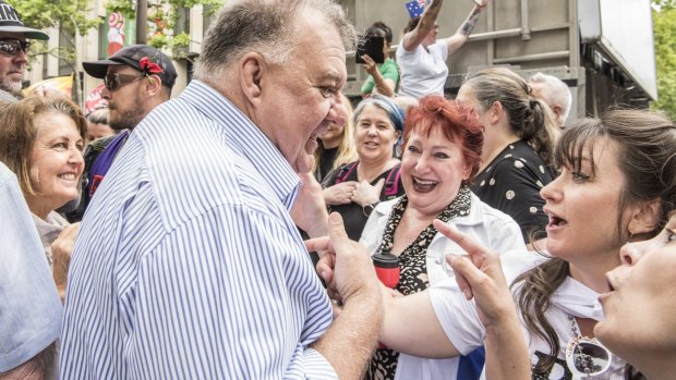 ‘We live in a prison camp’: Craig Kelly greeted with cheers at Sydney protest
