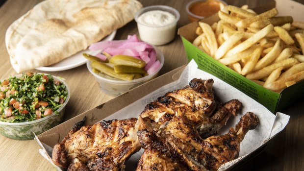 The essentials: whole charcoal chicken meal with Lebanese pickles, bread, tabouli, garlic dip, and fries.