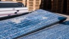 Discarded solar panels with shattered glass at a recycling facility in Arizona. Australia has few options for recycling panels.