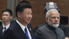 Chinese President Xi Jinping, left, and Indian Prime Minister Narendra Modi have little interest in the other's backyard. 