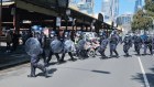 Dozens of police descended Queen Victoria market after anti-lockdown protesters marched through the iconic site as part of a 'Freedom Day'.