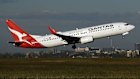 An Boeing 737-800 aircraft operated by Qantas takes off at Sydney Airport.