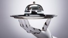 Robotic Hand Holding Service Bell In Plate Against Grey Background Robot chef, automated kitchen
iStock