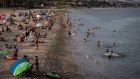 At the beach in Spain. International travel levels, both to and from Australia, are expected to return to pre-pandemic levels next year.