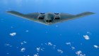A B-2 stealth bomber flying over the Pacific Ocean.