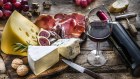 High angle view of delicious appetizer shot on rustic wooden table. The composition includes a selection of cheeses, Iberico ham, red wine, grapes and bread. Predominant colors are res, yellow and brown. XXXL 42Mp studio photo taken with Sony A7rii and Sony FE 90mm f2.8 macro G OSS lens Cheese platter
iStock