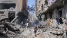 Palestinians at the site of an Israeli strike on buildings in Nuseirat refugee camp. Four hostages were freed while scores of Palestinians died in the attack. 