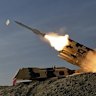 In this photo released by Iran’s army, a missile is launched during a military drill in southern Iran.