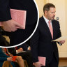 The story behind the pink Koran held by Australia’s first Muslim cabinet minister