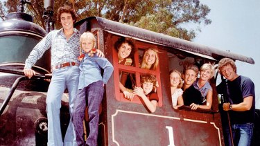 Three daughters, three sons, but only one Carol Brady (second from the right).