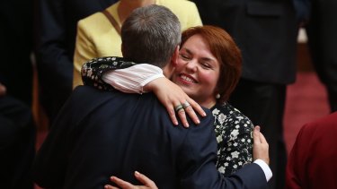 Senator Kimberley Kitching is embraced by Bill Shorten after her first speech in the Senate in 2016.