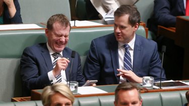 Labor MPs Nick Champion, left, and Ed Husic share a laugh during Question Time in 2015. 