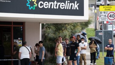 Job hunters queue up outside a Centrelink office.