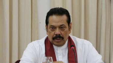 Sri Lanka's then appointed prime minister Mahinda Rajapaksa speaks to members loyal to him at his office in Colombo, Sri Lanka in November. 