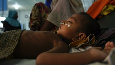 Jomil aged 2 lays unconscious whilst being treated for fever and breathing problems at the Medecins Sans Frontieres hospital in Kutupalong Camp. Kutupalong & Balukhali camps combined are the worlds largest refugee camp, home to approximately 400,000 of the 900,000 Rohingya who fled Myanmar.