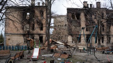 A damaged playground is seen next to a heavily damaged apartment building in Hostomel, Ukraine. The invasion has increased the risk of supply disruptions, pushing up energy, agricultural and metals prices.
