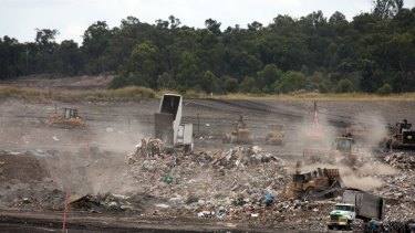 Queensland waste trucks dump unprocessed construction waste from NSW at Cleanaway's New Chum landfill in Ipswich.
