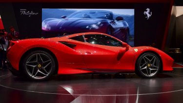 Authorities allege the man bought a Ferrari among other luxury cars with funds aimed at helping small businesses survive the COVID pandemic.