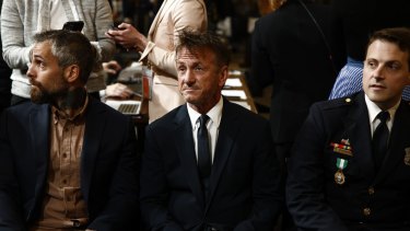 Michael Fanone, retired Metropolitan Police Department (MPD) officer, from left, actor Sean Penn and Daniel Hodges, MPD officer, attend the hearing.