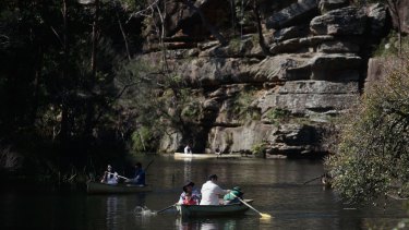 People canoeing at Audley Weir.