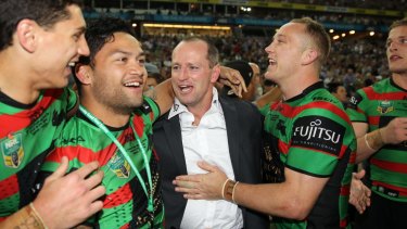 Happier days: Michael Maguire celebrates the Rabbitohs’ breakthrough premiership in 2014.