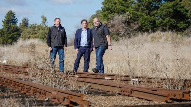 Director of Capital Recycling Solutions Adam Perry, Dean Ward from ActewAGL, and project manager Ewen McKenzie, at the former Shell site. They planned to use the railway to export recyclables.