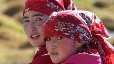 Two ethnic Kyrgyz women in the Karakorum mountain range in China's western Xinjiang province. The area, close to China's borders with Afghanistan, Pakistan and Tajikistan, is populated by a variety of ethnic groups. 