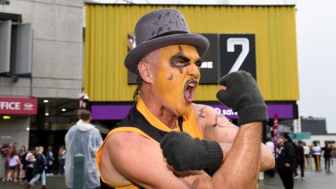 A Richmond fan shows his colours before the 2020 AFL Grand Final match between the Richmond Tigers and the Geelong Cats at The Gabba.