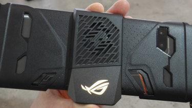 The fan is adjustable, so it fits over cases and the detachable gamepad accessory.