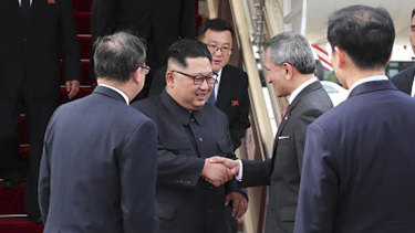 North Korean leader Kim Jong-un is greeted by Singapore Minister for Foreign Affairs Vivian Balakrishnan at Changi International Airport. 