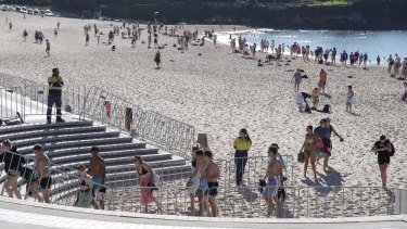 People leave Coogee Beach through designated entry and exit points.