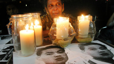 Letchumi Murugesu, mother of Shanmugam Murugesu, who was hung for drug trafficking, attends a vigil held for Australian Ngyuen Tuong Van just hours before his execution in 2005.