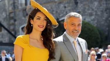 Amal Clooney and George Clooney arrive at St George's Chapel at Windsor Castle for the wedding of Meghan Markle and Prince Harry.