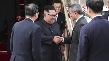 North Korean leader Kim Jong-un is greeted by Singapore Minister for Foreign Affairs Vivian Balakrishnan at Changi International Airport. 