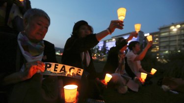 Protesters hold candle lights during a rally to denounce the United States' policies against North Korea near the U.S. embassy in Seoul last month.