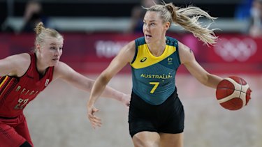 Australiaâ€™s Tess Madgen (7) drives up court past Belgiumâ€™s Hanne Mestdagh (22).