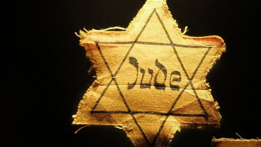 A cloth star with the word 'Jude', German for Jew, that Jews had to wear during the Nazi occupation.