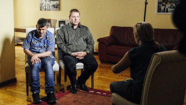 Rachael Brown interviewing Maria James' sons, Adam (at left) and Mark.