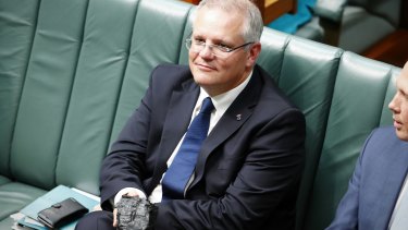 Prime Minister Scott Morrison holding a  lump of coal during question time in 2017.
