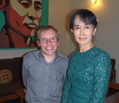 Sean Turnell, left, has long provided advice to Myanmar’s elected leader Aung San Suu Kyi, right. 