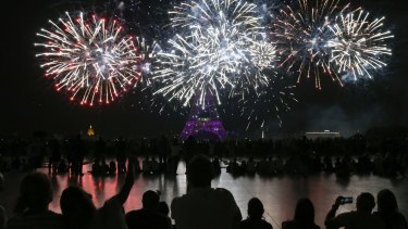 Fireworks illuminate the Eiffel Tower in Paris during Bastille Day celebrations in 2018.