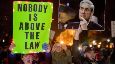 Protesters in front of the White House in Washington on November 8 as part of a nationwide 'Protect Mueller' campaign demanding that Acting US Attorney-General Matthew Whitaker recuse himself from overseeing the Russia probe.