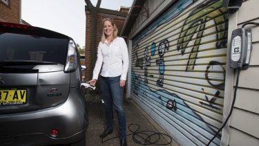 Carola Jonas chargers her electric Mitsubishi EV car. 