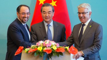 From left, Afghanistan's Salahuddin Rabbani, China's Wang Yi and Pakistan's Khawaja Asif at the first China-Afghanistan-Pakistan Foreign Ministers' Dialogue in Beijing in December.